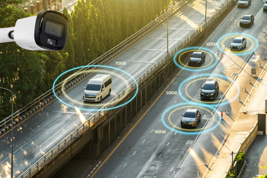 Speed camera surveillance system detecting vehicles on highway road with tracking boxes and speed data overlay