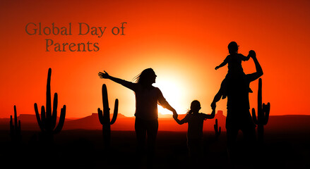Fototapeta premium Silhouette of happy family holding hands during sunset in desert celebrating global day of parents together