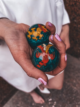 Close-up: a man's hands holding classic Chinese Baoding massage balls