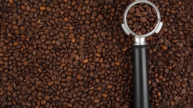 Close-up of roasted coffee beans with espresso portafilter in the center