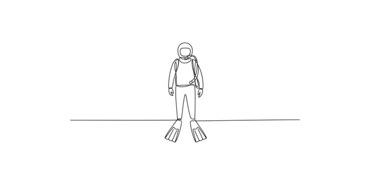 A scuba diver wearing flippers and a diving suit standing on the ocean floor with a backpack
