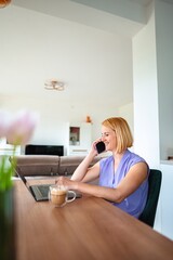 Working from home while enjoying a cup of coffee © Jelena