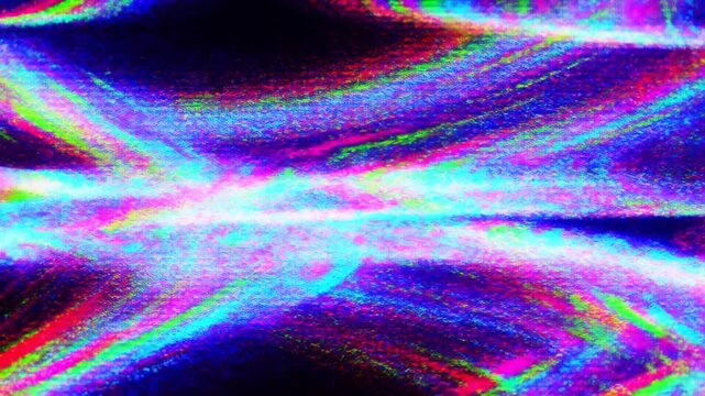 Panning shot of iridescent glitter particles flowing and blending across black background in abstract luminous wave motion