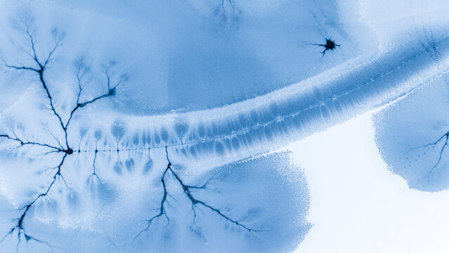 Abstract ice background shows frozen patterns, texture and copy space, Fusine lakes, Tarvisio, Friuli, Italy.
