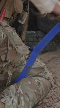 Tactical medicine training applying a tourniquet to stop bleeding.