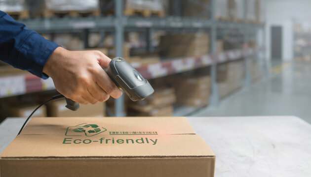 Smart logistics e commerce warehouse worker scan barcode on eco friendly parcel for green delivery and inventory control in distribution center