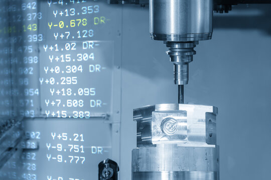 Double exposure of a 5-axis CNC milling machine cutting aluminum parts and digital G-code data background.