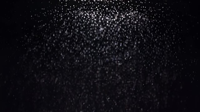 Falling snow on a black background.