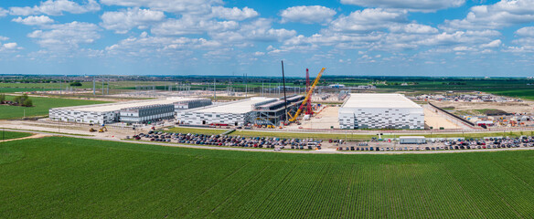 Fototapeta na wymiar Aerial view of the construction of a massive AI data center campus with 400 million square feet hosting and 600MW capacity in Hutto Texas