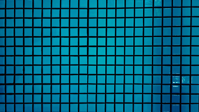 Teal Blue Mosaic Tile Wall Texture Background with Square Ceramic Tiles and Dark Grout Lines for Bathroom Kitchen Swimming Pool Interior Design and Modern Architectural Geometric Surface.