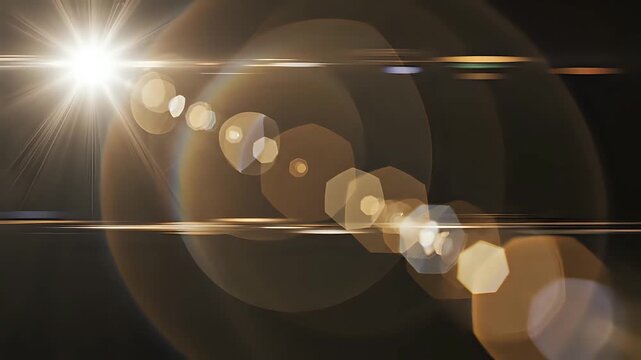 Bright Lens Flare Effect with Starburst and Bokeh Over Dark Background.