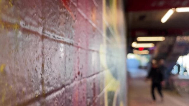 Skatepark mural with blurred skater figure in motion, colorful wall texture in foreground, urban training session with ramp and street atmosphere, dynamic energy and rhythm