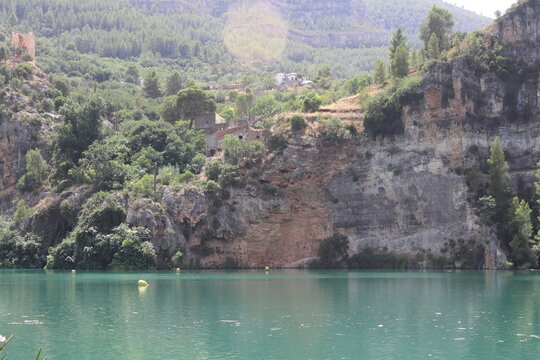 Ancient Watchtower and Rural Houses on Limestone Cliffs in Cortes de Pallas
