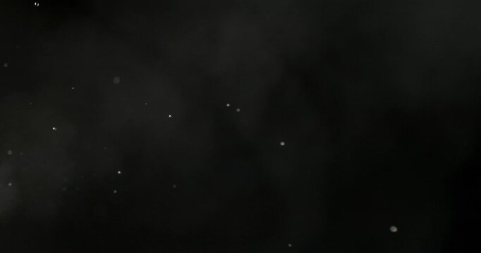 Super slow motion (1000 fps) vapor and fine droplets dispersing in air on black background. Misty fluid particles with soft light, evoking evaporation, diffusion and abstract motion.