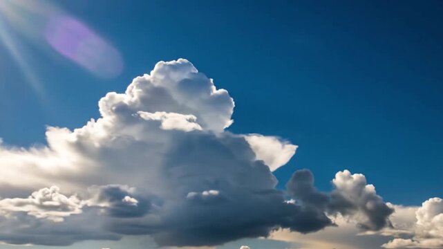 A serene video of a large cloud formation in a clear blue sky