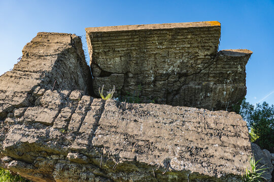 remnants of large concrete fortifications intended for the military