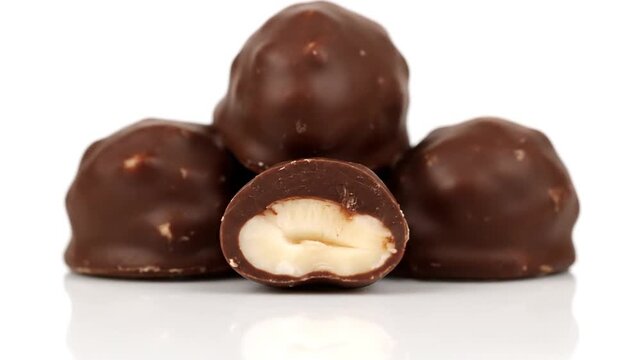 Chocolatecovered candies on a white background.