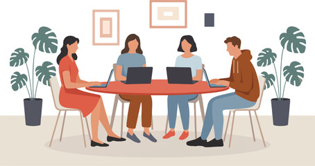 Fototapeta premium Diverse group of professional colleagues working on laptops at a round table in a modern coworking office space interior.