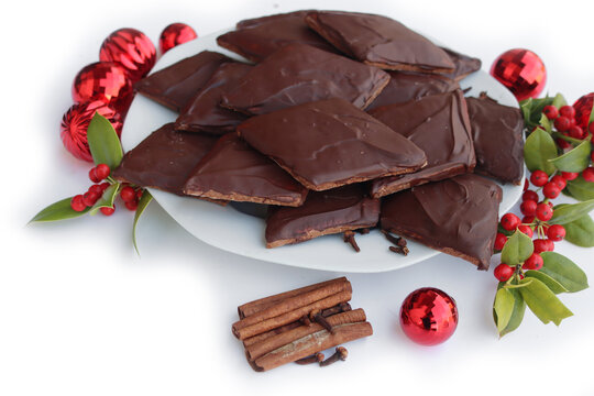 Italian traditional festive cookies called Mostaccioli or Mustaccioli on white background with copy space. Christmas cookies made mith Pisto, a mix of various spices 