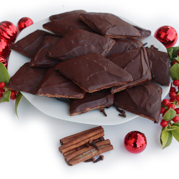 Italian traditional festive cookies called Mostaccioli or Mustaccioli on white background with copy space. Christmas cookies made mith Pisto, a mix of various spices 