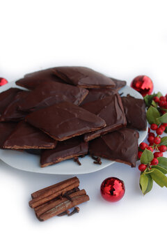 Italian traditional festive cookies called Mostaccioli or Mustaccioli on white background with copy space. Christmas cookies made mith Pisto, a mix of various spices 