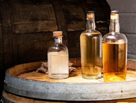 Bottles of Irish Whiskey sitting on a wood barrel