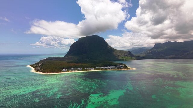 Aerial view of Le Morne Brabant mountain and turquoise lagoon in Mauritius, tropical island landscape with white sand beach and coral reef