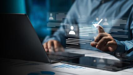 Digital evaluation and recruitment concept with person touching checkmark on virtual user profile interface. © Dee karen