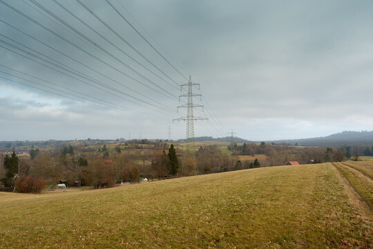High voltage power lines and transmission tower in a rural landscape near Nurtingen, Germany