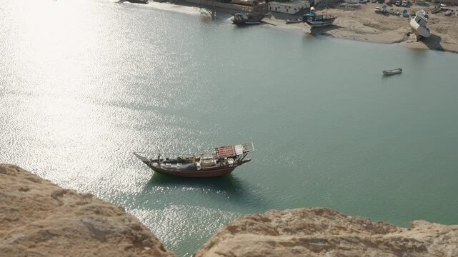 Slow Motion High-Angle View of Dhow on Water from Sur Lookout Tower, Cinematic Omani Maritime Perspective