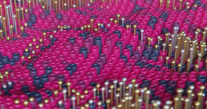 Vibrant beads form abstract, flowing patterns loop