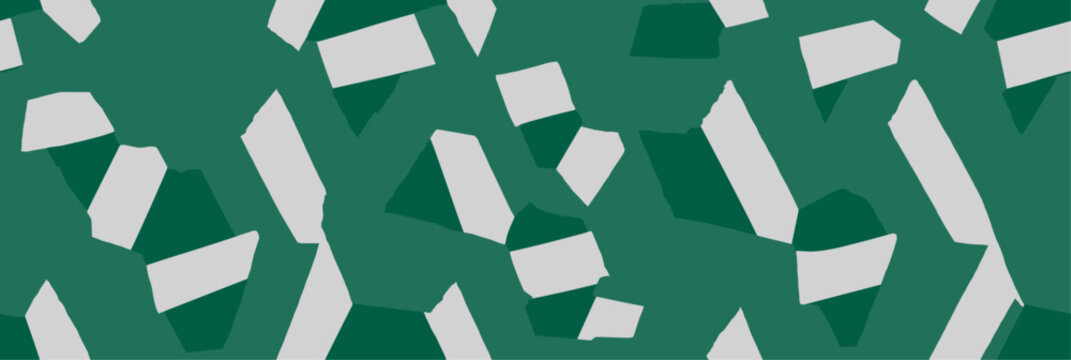 Abstract bicolor pattern featuring light gray triangles on a solid green background. Geometrical triangular shapes repeating seamless pattern