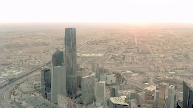 Panoramic Drone View of Riyadh City Skyline Featuring Kingdom Centre and Urban Traffic