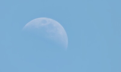 Half moon on blue sky background © dule964