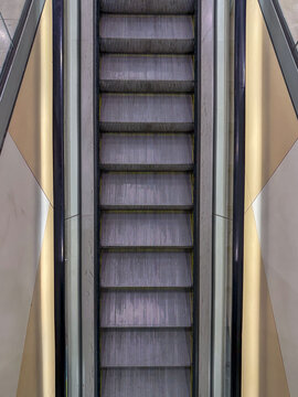 Overhead View of Escalator with Symmetrical Lines and Modern Architectural Design
