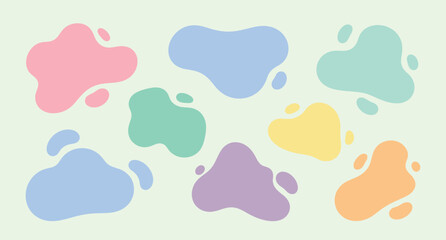 Fototapeta premium Pastel organic blob shapes scattered on light green background, abstract organic shapes