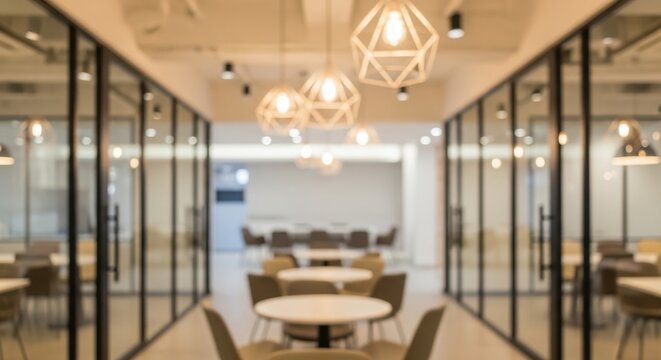 Modern office space with glass partitions and central meeting area