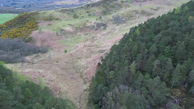 Aerial View of Balmaha Valley Glasgow Landscape over Mountains of UK During Sunset Time. The village is a popular tourist destination for picnickers and day trippers from Glasgow Scotland, UK