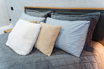 Gentle Hues With Plush Furnishings. Relaxing Setting Decorated With Soft Cushions And Muted Shades. Comfortable Space Showcasing Textured Pillows And Peaceful Color Palette © Aleksey