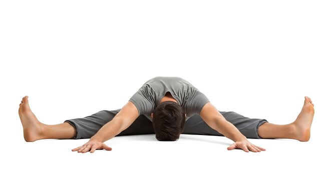 A man in a gray shirt and pants is stretching on the floor in a yoga pose