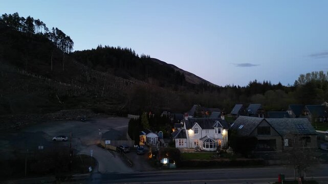Aerial View of Balmaha Valley Glasgow Landscape over Mountains of UK During Sunset Time. The village is a popular tourist destination for picnickers and day trippers from Glasgow Scotland, UK