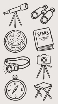 Hand-drawn vector doodle set of astronomy and stargazing tools including a telescope, binoculars, planisphere, and compass