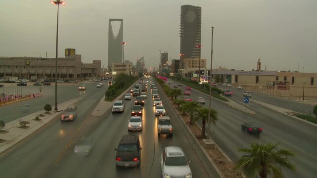 Riyadh City Skyline Aerial View Featuring Kingdom Tower and Heavy Traffic Flow on King Fahd Road, Saudi Arabia.