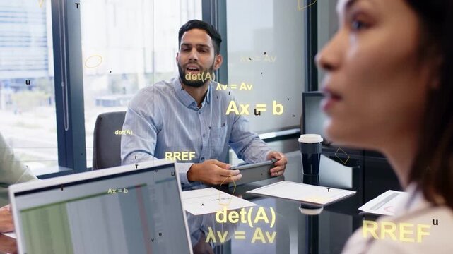 Man tapping tablet, talking and gesturing while math overlays appearing, explaining matrix for team
