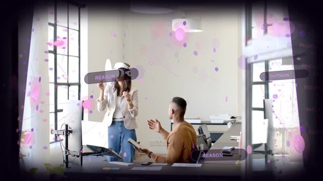 Woman adjusting VR headset and manipulating holo UI while seated man tapping tablet for tech demo