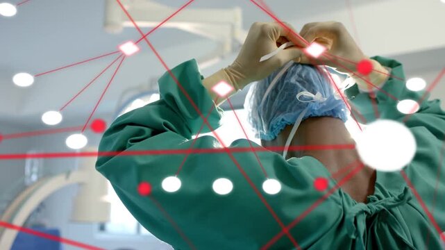 Surgeon raising gloved hands securing cap strap for preop, animated nodes intensifying over frame