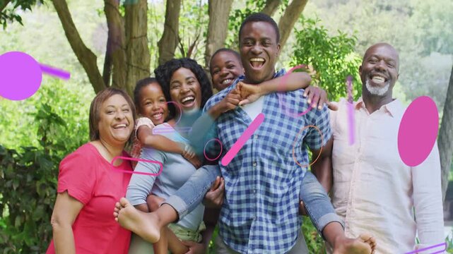 Family group posing in park, graphic shapes entering from edges obscuring then fading for marketing