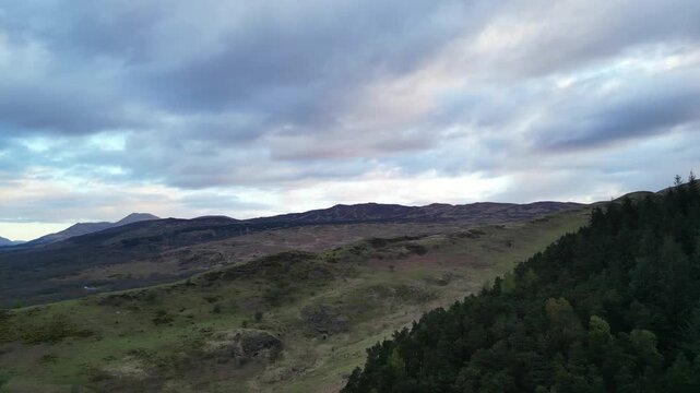 Aerial View of Balmaha Valley Glasgow Landscape over Mountains of UK During Sunset Time. The village is a popular tourist destination for picnickers and day trippers from Glasgow Scotland, UK
