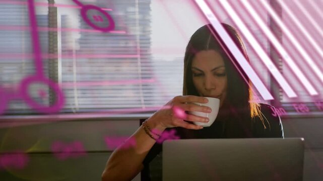 Woman sipping mug at desk, laptop sending pink data overlays sweeping across face for analytics