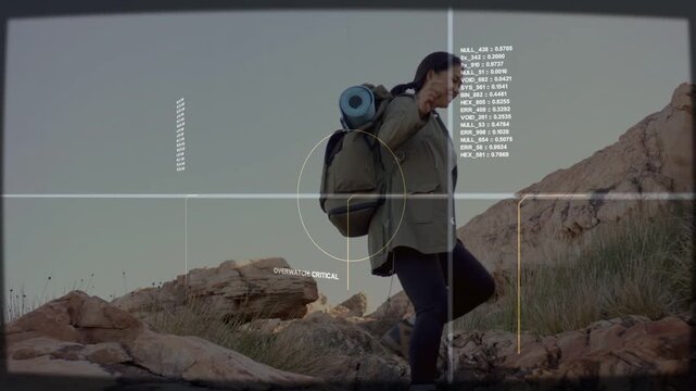 Female hiker navigating rocky slope, HUD reticle locking on and tracking movement for navigation
